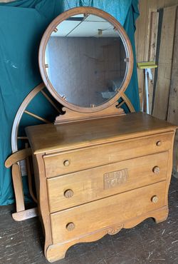 Solid oak dresser with mirror, headboard, footboard and side rails.