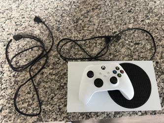 Xbox Series S with controller and cords .