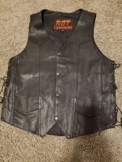 Leather chaps and vest and jacket for motorcycle.