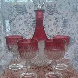 Vintage Indiana Glass Decanter set with four glasses. These are known as "Kings Diamond Point Ruby Red" pattern.