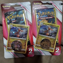 Two Pokemon Card Packs Each Contains 2 Mini Packs Plus A Metallic Coin . Sealed.