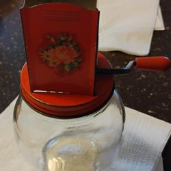 VINTAGE NUT GRINDER GLASS w RED METAL TOP & DECAL