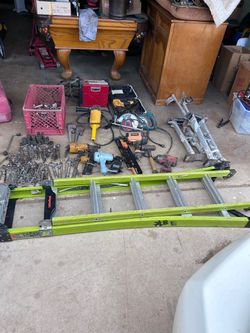 Tool lot ladders saw nail guns stilts