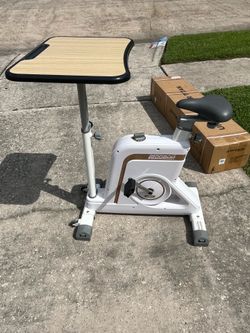 Exercise bike with adjustable desktop $150obo
