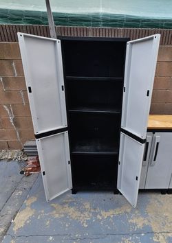 Keter Outdoor indoor storage cabinet with shelves, good condition