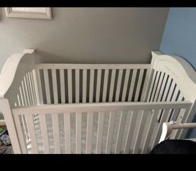 White crib and mattress