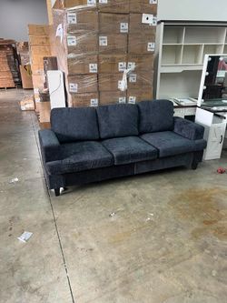 Gray three-seater comfortable sofa