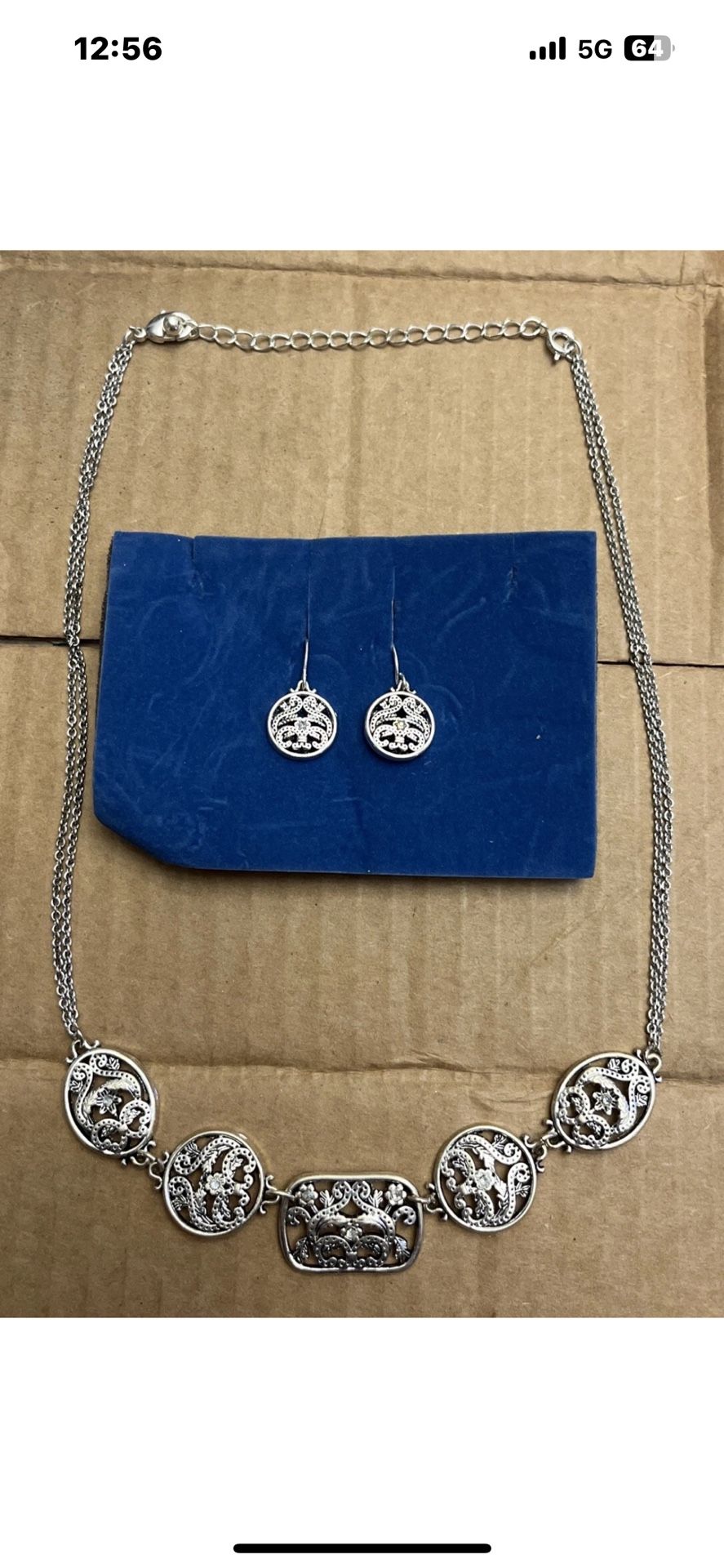 Silver toned necklace and earring set.