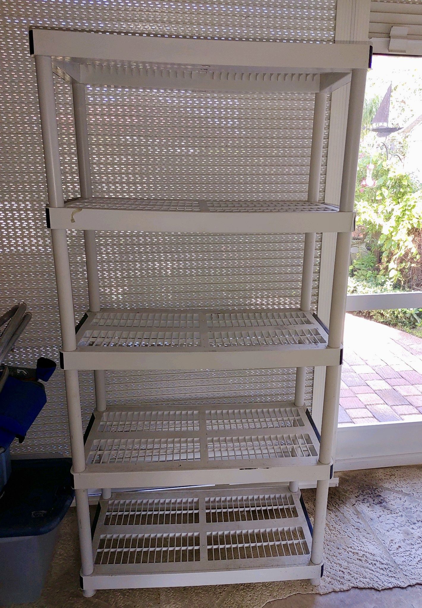 Preowned plastic shelving rack garage shelf