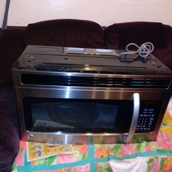 General Electrity, Wall Mounty Microwave, With Bracket To Go On The Wall.