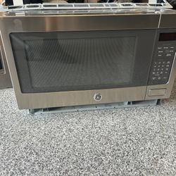 Stainless Steel GE microwave with trim