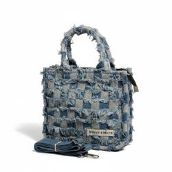 MIRFNE & Mibansi MIRFNE & Mibansi Denim Patched Purse Crossbody Shoulder Straps Bag Red Interior Zipper. Excellent Condition.
The image shows a denim-