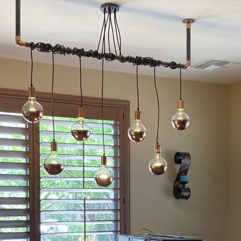 Custom chandelier and pendant lights. We paid $1,000 for all. They are individually made and custom built but not our style once we had them in the h