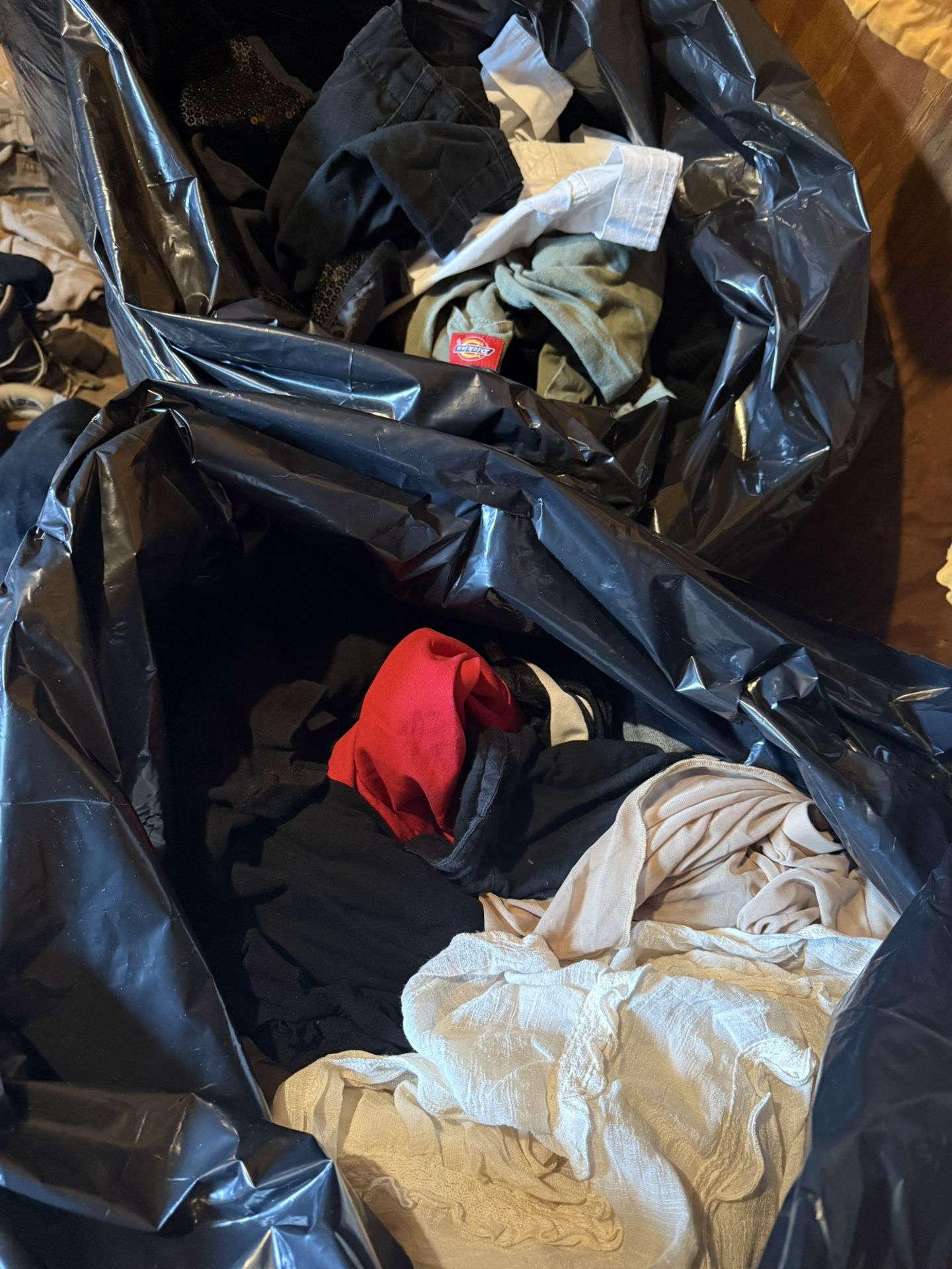 Two large garbage bags with women's clothes size s