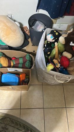 big bins and boxes of toys and plushies/stuffed animals