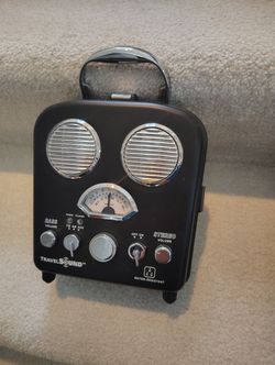 Portable TravelSound AudioBox AM/FM radio and amplified stereo speaker system.