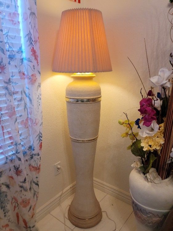 Elegant Tall Floor Lamp with pleated shade and gold accents.