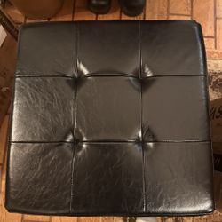 Synthetic black ottoman 