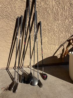 Seven left-handed golf clubs Seven left-handed golf clubs