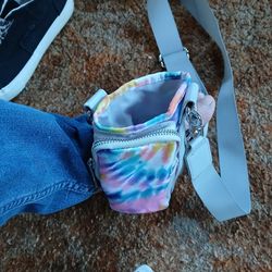 Bottle holder with phone case attached with strap