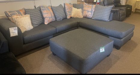 grey couch with all pillows