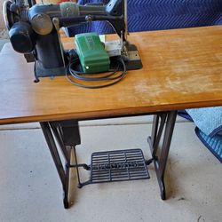 Antique Sewing Machines And Desk