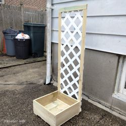 Raised Planter Box With White Lattice Trellis