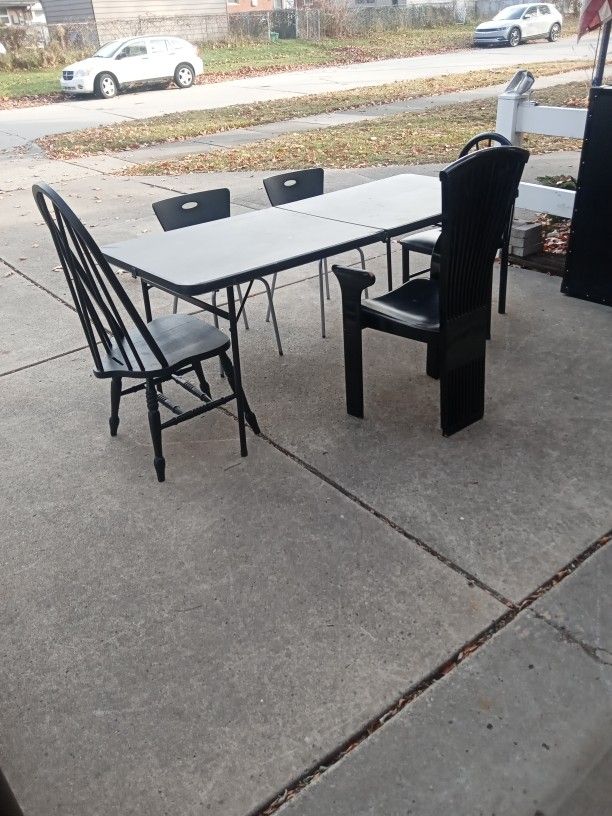 Black Folding Table And Five Chairs 