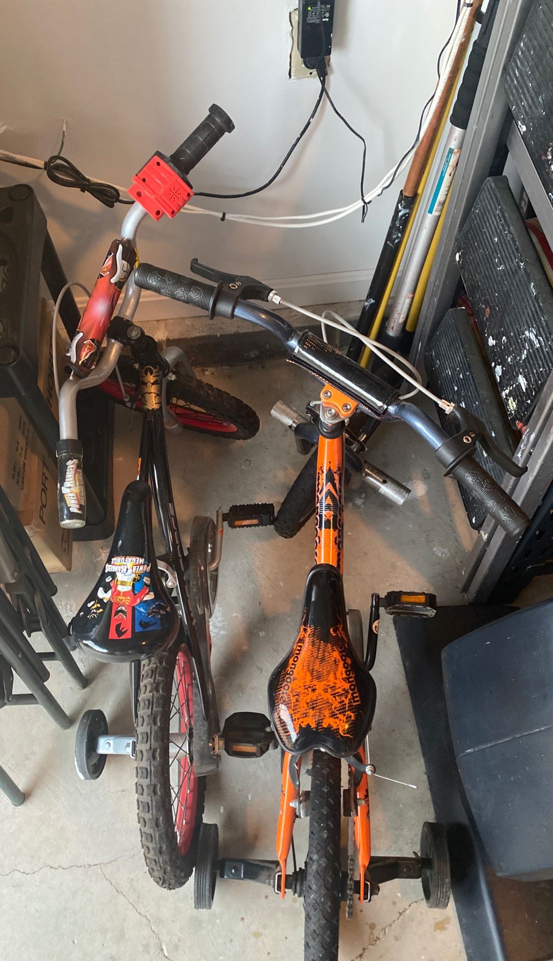 Two kid bikes with training wheels