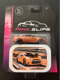 JADA Pink Slips Nissan GT-R in Orange 1:64 Diecast + Collector's Storage Tin Box