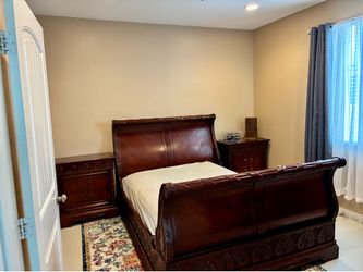 FREE Four-Piece Wooden Sleigh Bedroom Set