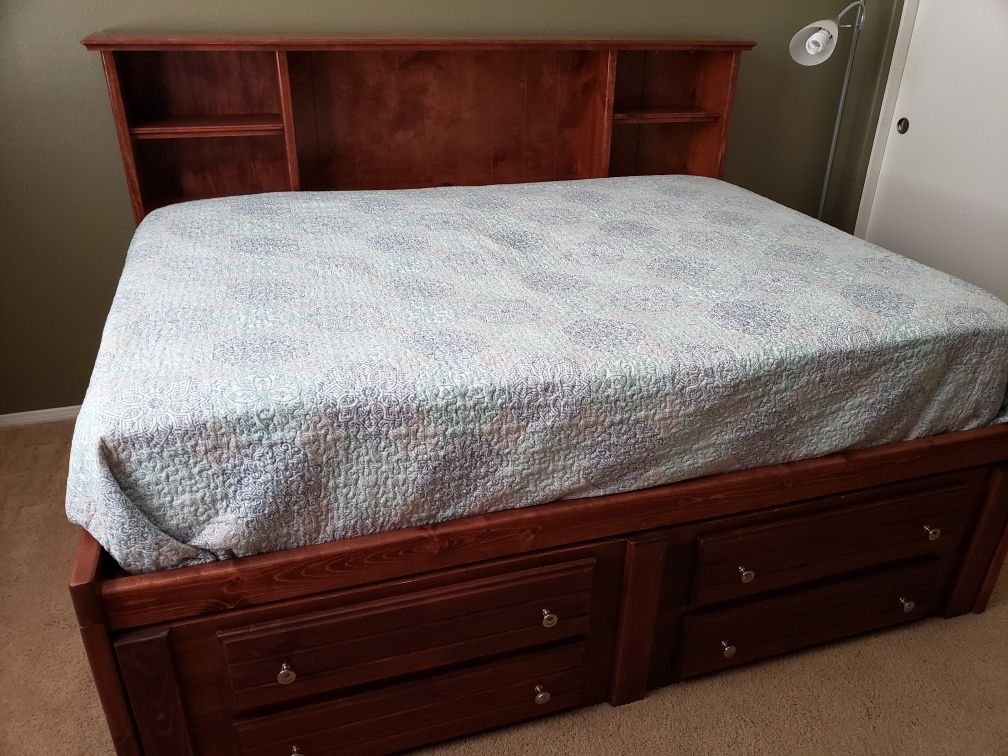 REDUCED!!! Priced to sell. Wood full sized captain's bed with dresser and mattress.