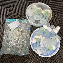 Lot Of Baby Bottles, Tops, And Sterilizer 