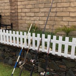 THREE (3) Saltwater Fishing Rods (6’-11’) with Penn Reels plus a Fishing Gaff