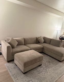 Sectional sofa with ottoman that has storage