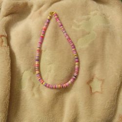  Clay beaded necklace.purple pink and yellow random.