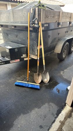 Round Nose Shovel And A Push Broom