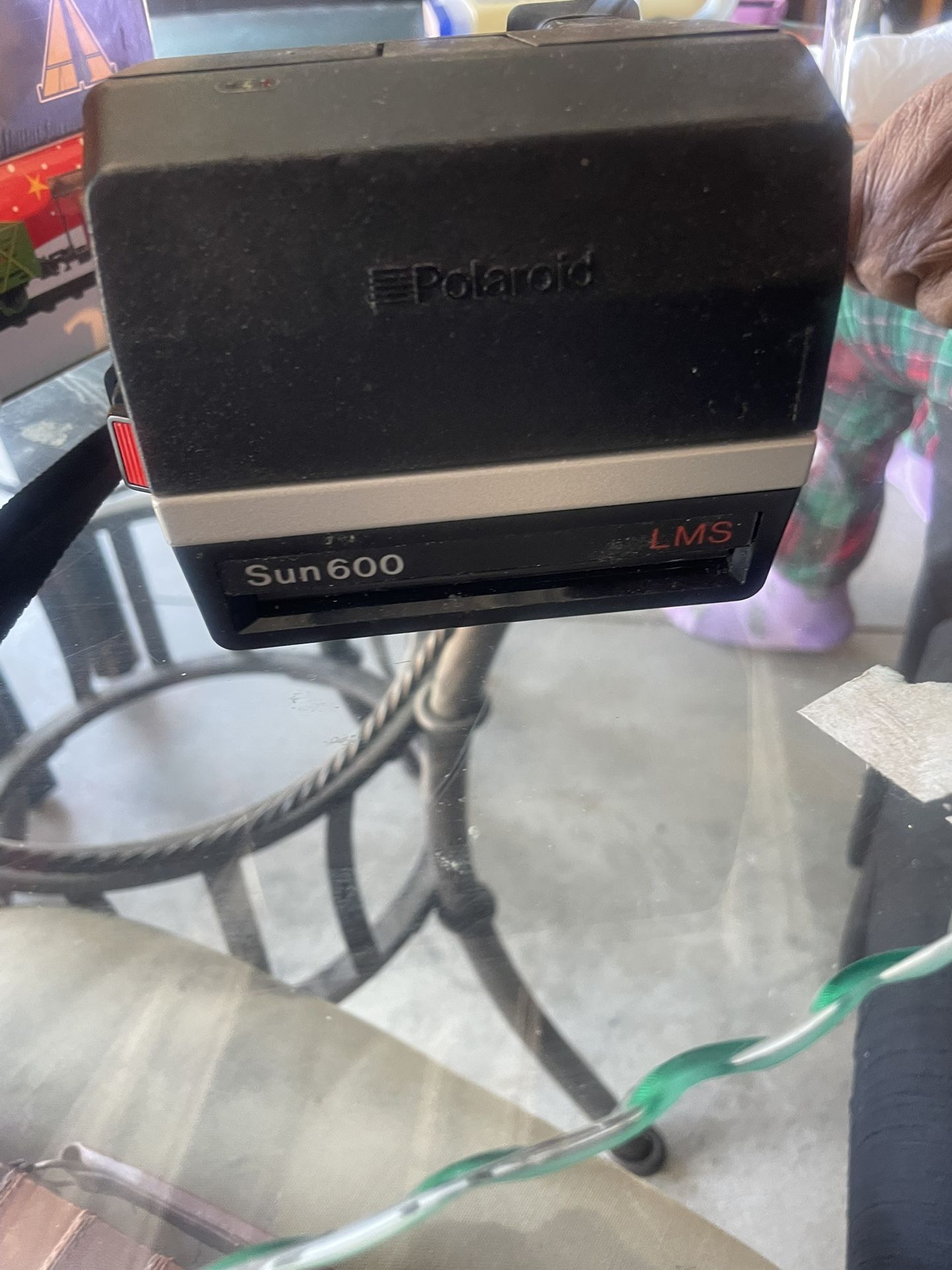 vintage Polaroid Sun 600 LMS instant film camera. 