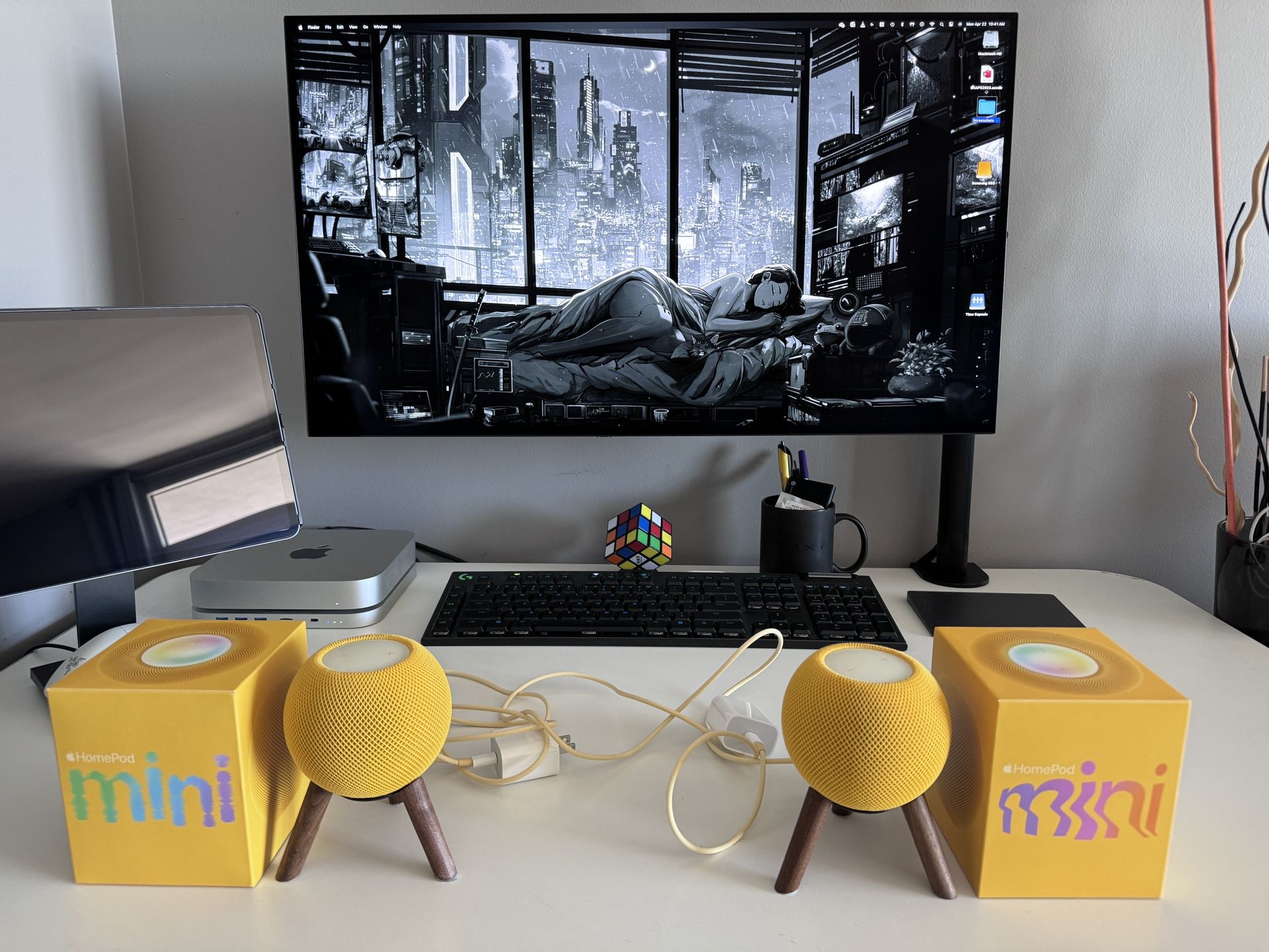2 yellow Apple Homepod Minis with real wood stands