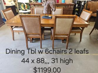 Wood Dining Table with 6 Chairs and 2 Leaves We are located at 2811 East Bell road. Another Time Around Furniture.
