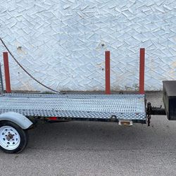 Trailer 8.8 x 4 ft with tool box and car ramps.