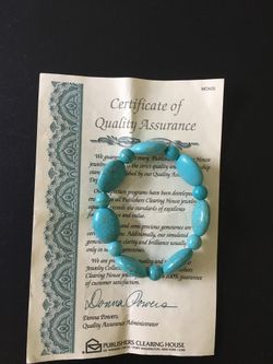 turquoise bracelet. Dana power design. came with paper certificate