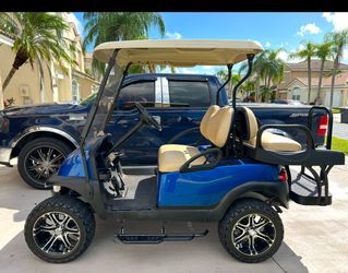 Royal blue golf cart And white