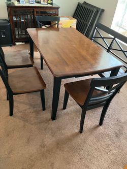 Table with chairs and bench