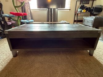 Wooden table with pop up table & storage