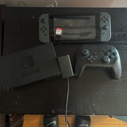 nintendo switch with pro controller, sd card, and games 