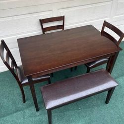 LIKE NEW 5-PC MINIMALIST LIGHT WEIGHT BROWN FINISH DINING SET (1 TABLE 3 PADDED CHAIRS AND ONE PADDED BENCH)