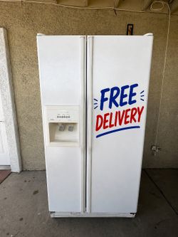Kitchen Aid side by side refrigerator in great working condition. Everything works