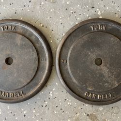 York Barbell Each 25 lb standard cast iron weight plate