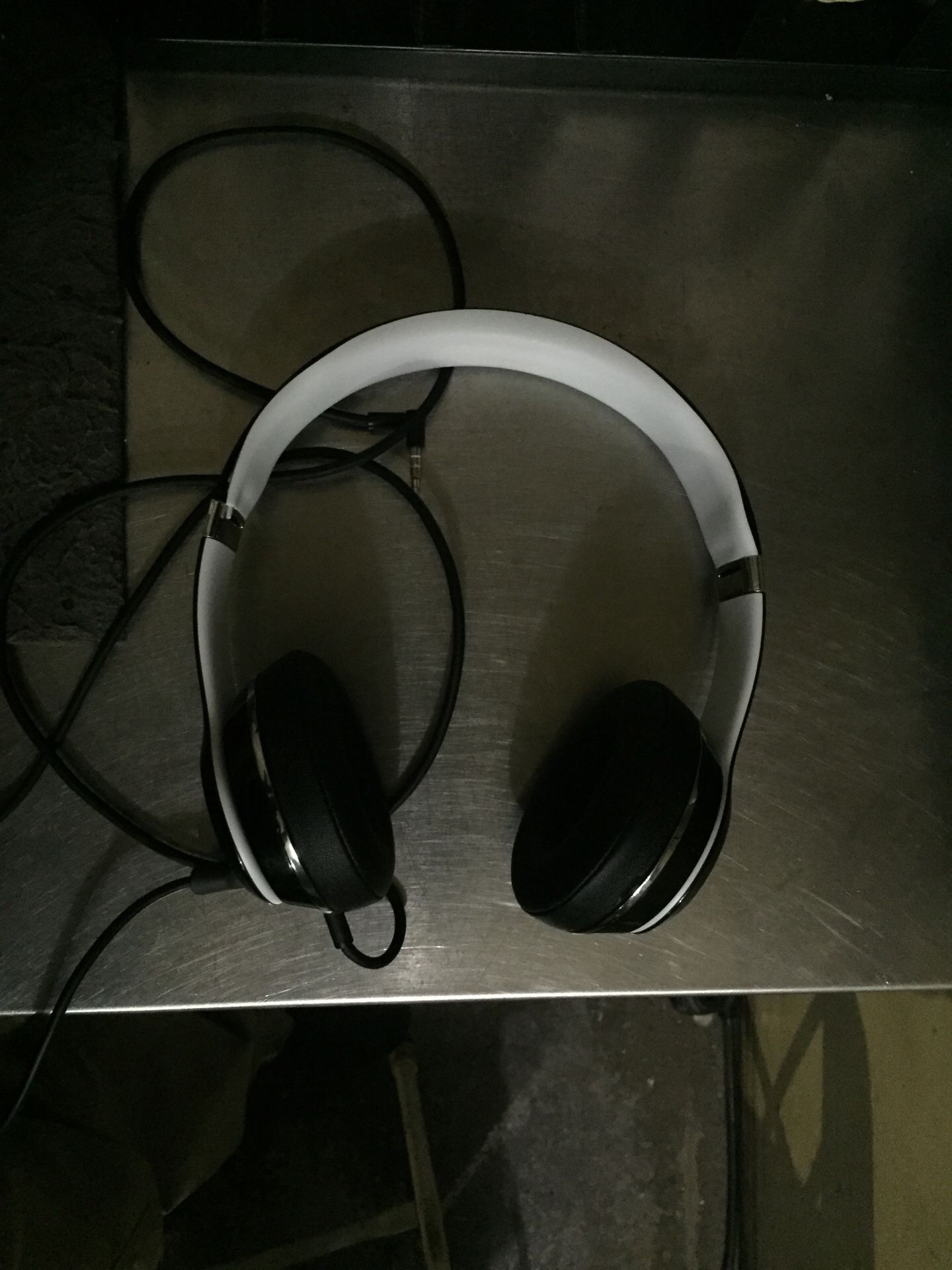 Black and white Beats by Dre headphones